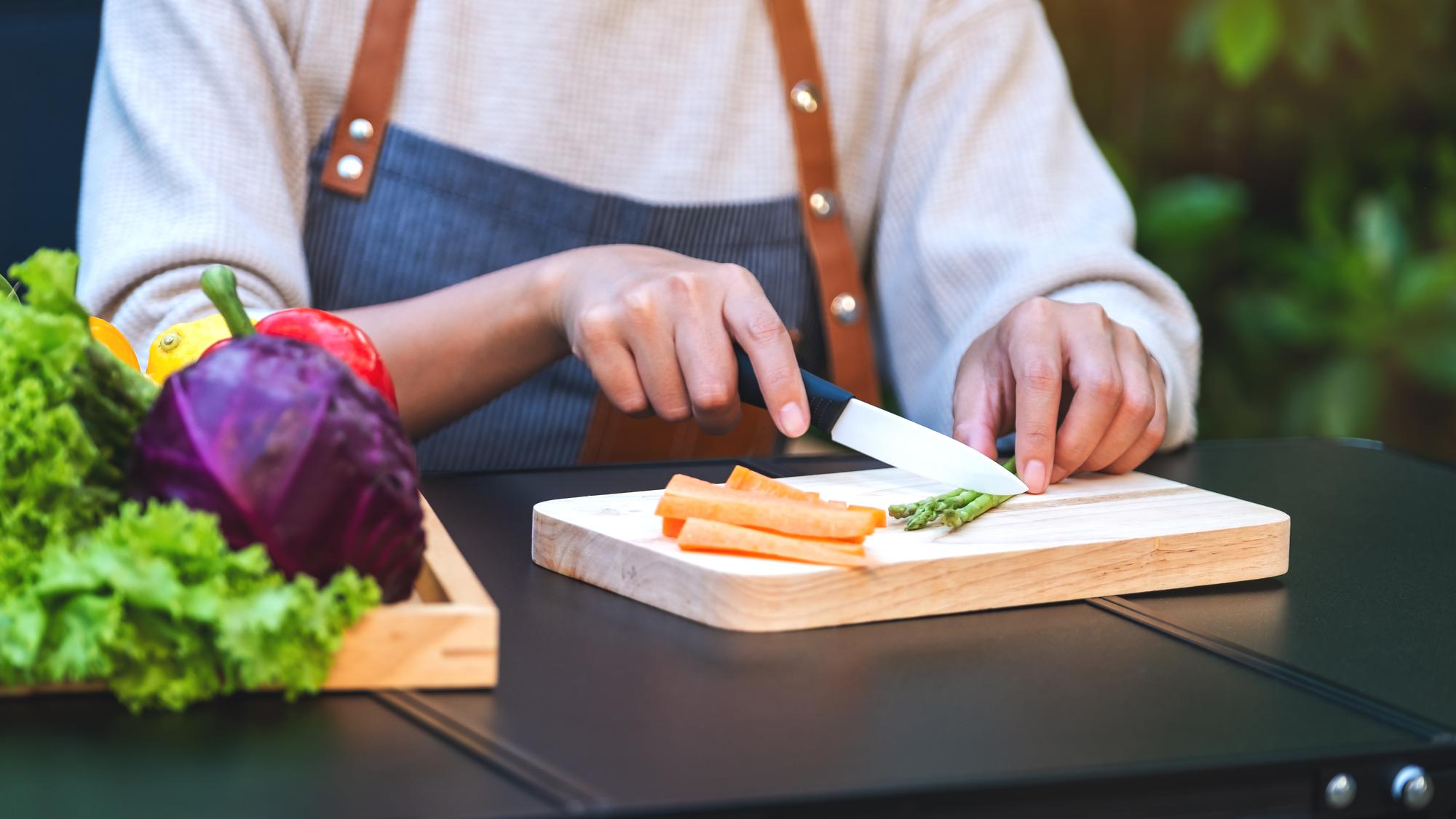Instructor preparing ingredients on worktop