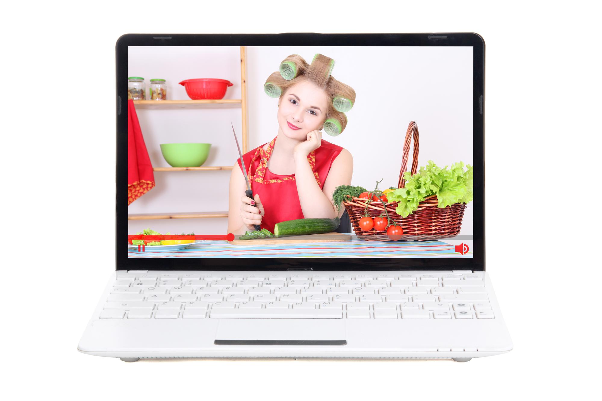 Laptop with cooking lesson interface